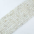 Natural white moonstone chip bead strand 31.5 inches long on white background, irregular 5-8mm chips strung on nylon cord for jewelry making