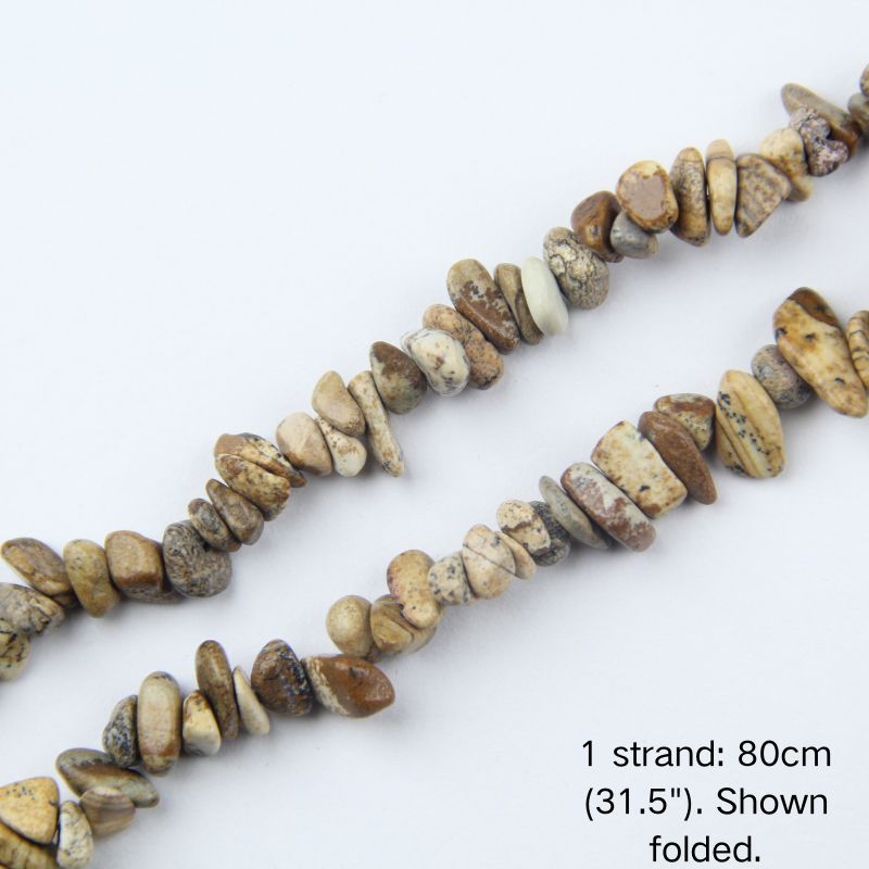 Close-up of picture jasper chip cord, 80cm folded, showing 5-8mm stones with natural cream, tan, and brown earthy patterns.