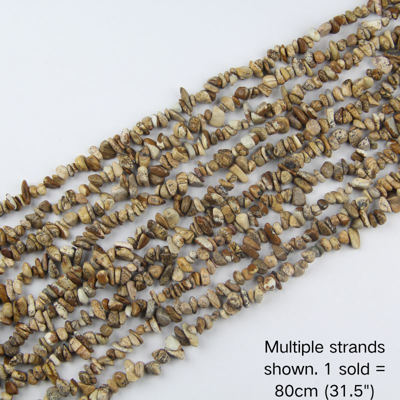 Multiple strands of natural picture jasper chips, earthy cream and brown stones with organic speckles, 31.5 inch beaded cord. 1 sold equals 1 strand.