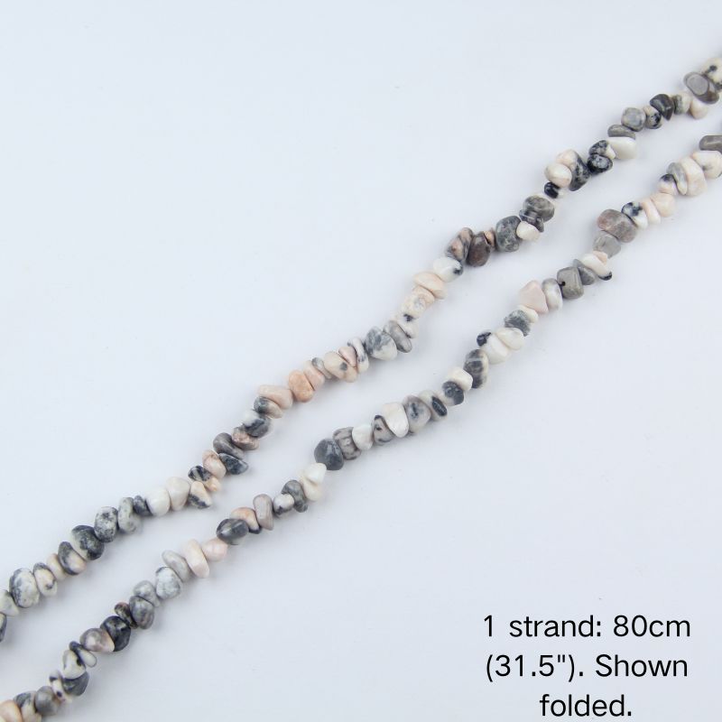 Pink zebra jasper chip beaded strand, 31.5 inch (80cm) length shown folded on white background.