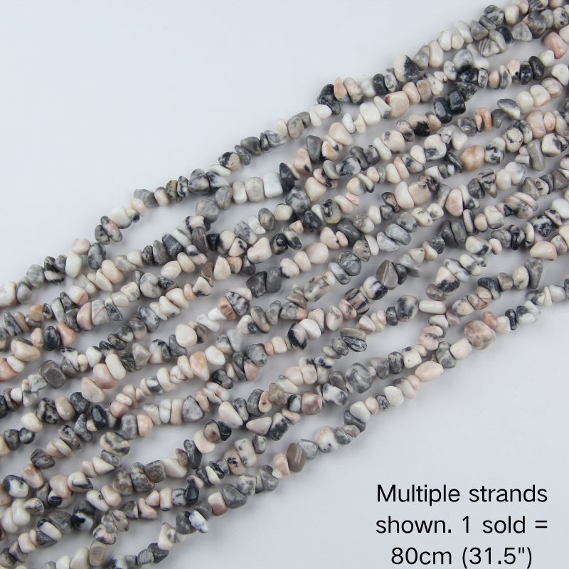 Multiple strands of natural pink zebra jasper chips, creamy white with pink and grey stripes, 31.5 inch beaded cord for jewelry making and boho decor.