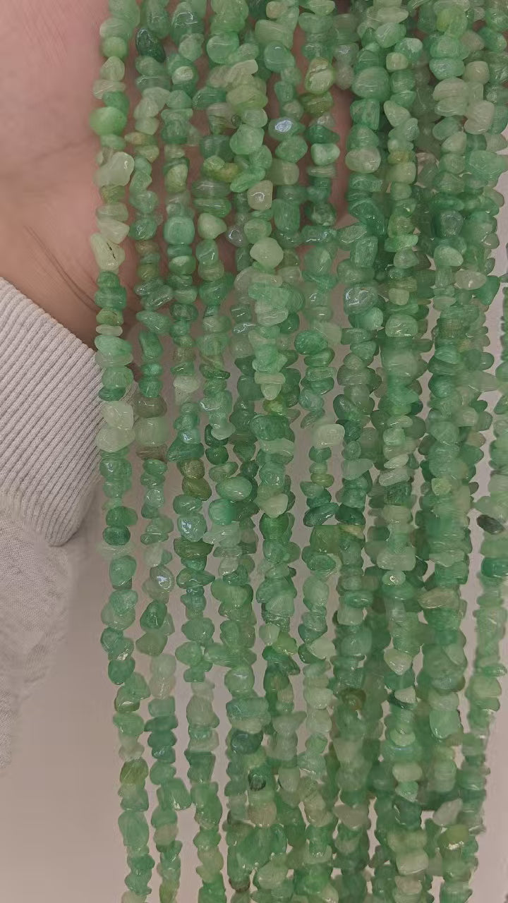 Unboxing and wearing demo of natural green aventurine beaded necklace. Features 31.5 inch length and natural mica inclusions in forest green irregular round gemstone beads. 