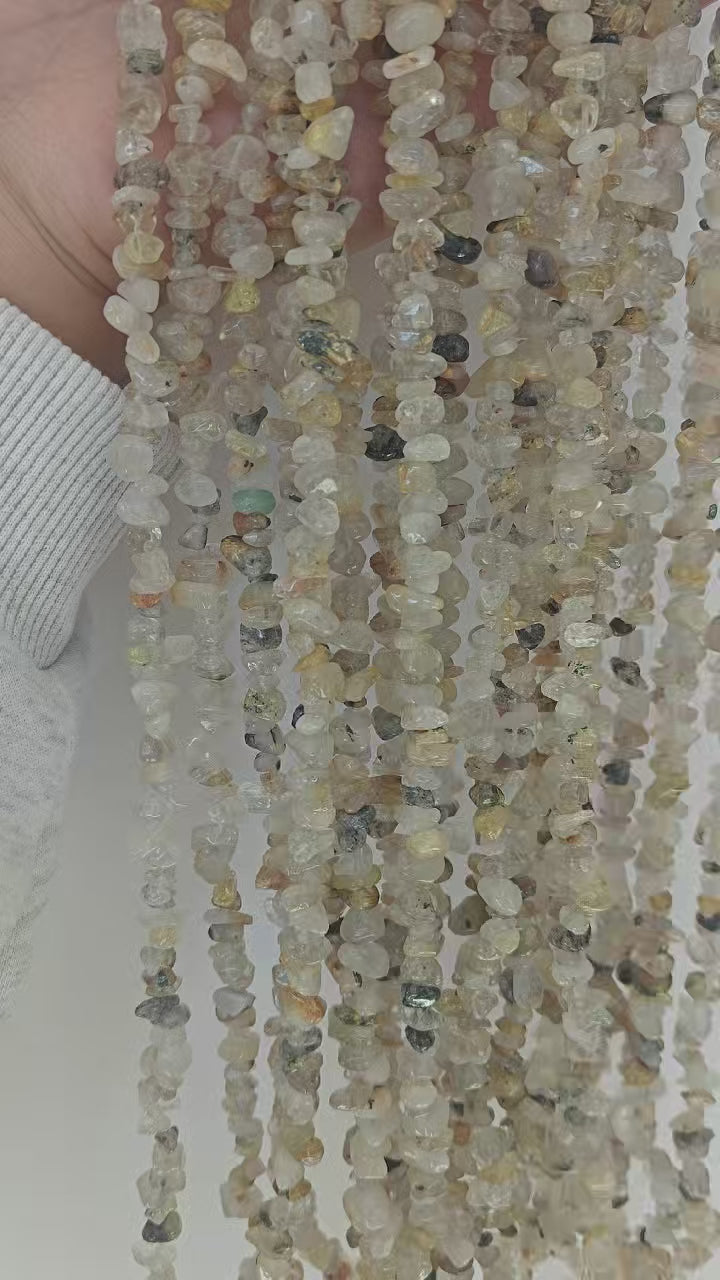 30-second showcase of natural titanium golden rutilated quartz necklace, capturing the sparkling flash of golden needle inclusions when rotating in light 