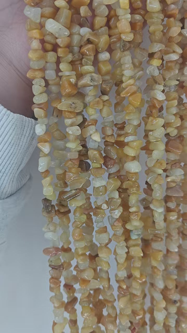 Full view of natural yellow aventurine 31.5 inch beaded necklace. Demonstrates 5-8mm irregular beads luster and layering effect of the sunny yellow gemstone jewelry.