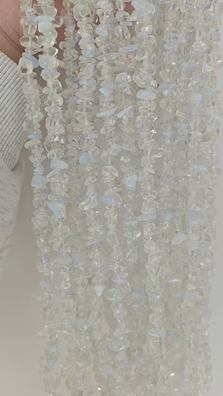 360 rotation of white blue opalite irregular bead long necklace, soft opalescent glow visible from all angles with milky glass appearance