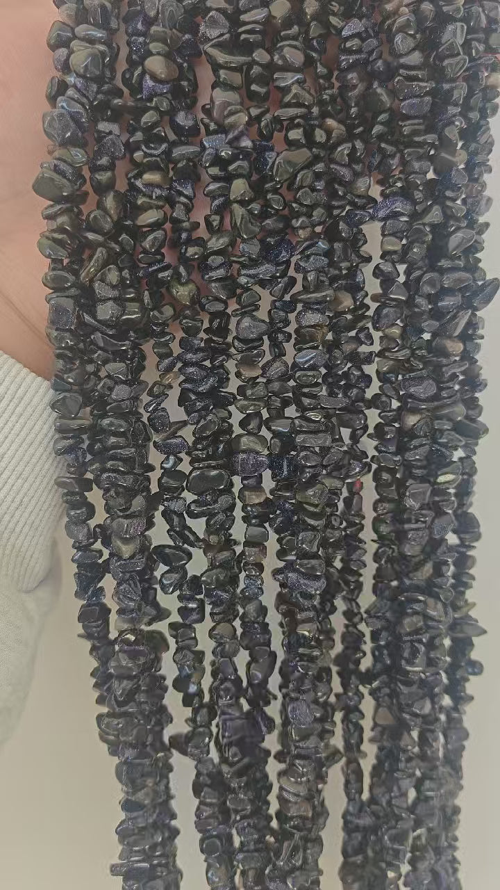 360 rotation of blue sandstone irregular chip bead long necklace, copper sparkles catching light from all angles like stars in midnight sky