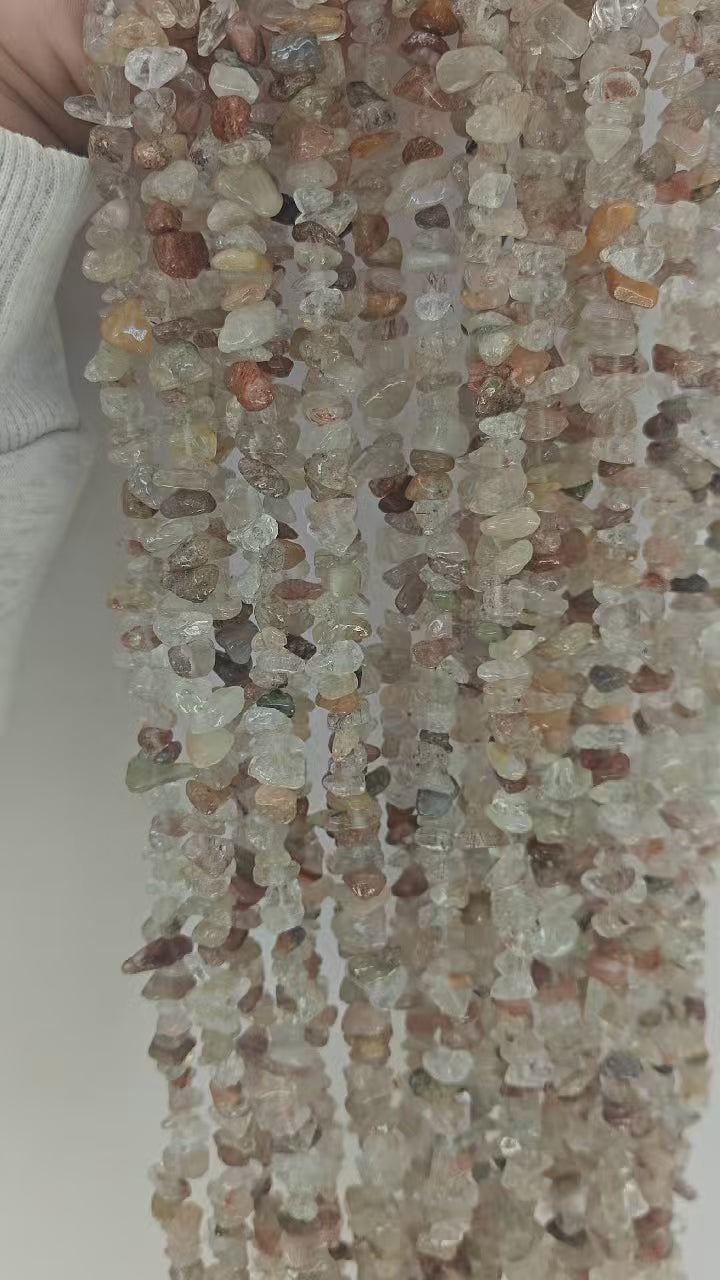 model wearing video of natural reddish copper rutilated quartz long necklace, showing the warm vintage copper tone and swaying effect when walking 