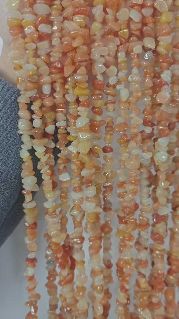 Outfit matching for natural red aventurine statement necklace. Displays the deep warm tone and unique mineral texture of 5-8mm irregular red aventurine beads. 
