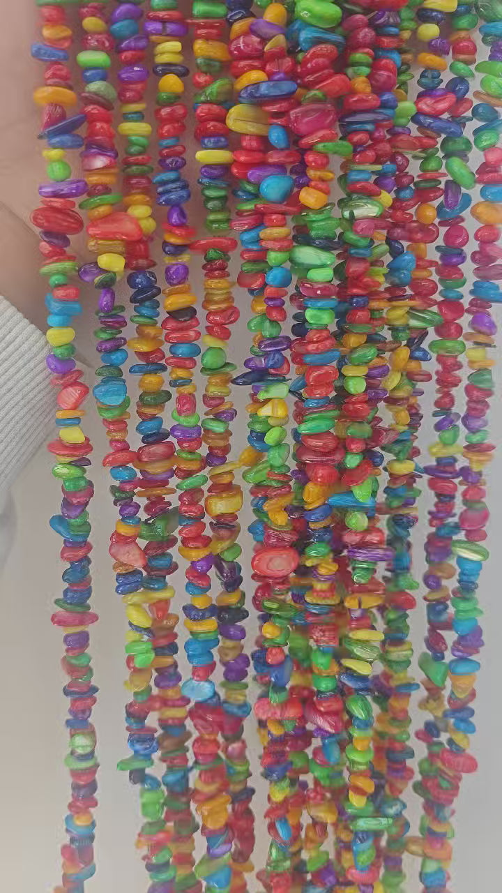 360 rotation of rainbow dyed shell irregular bead long necklace, full color spectrum visible from all angles with natural shell luster