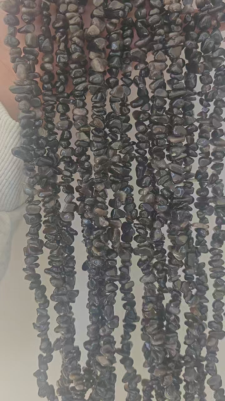 360-degree rotating view of silver obsidian irregular bead necklace showing metallic silver sheen from all angles as light moves across beads