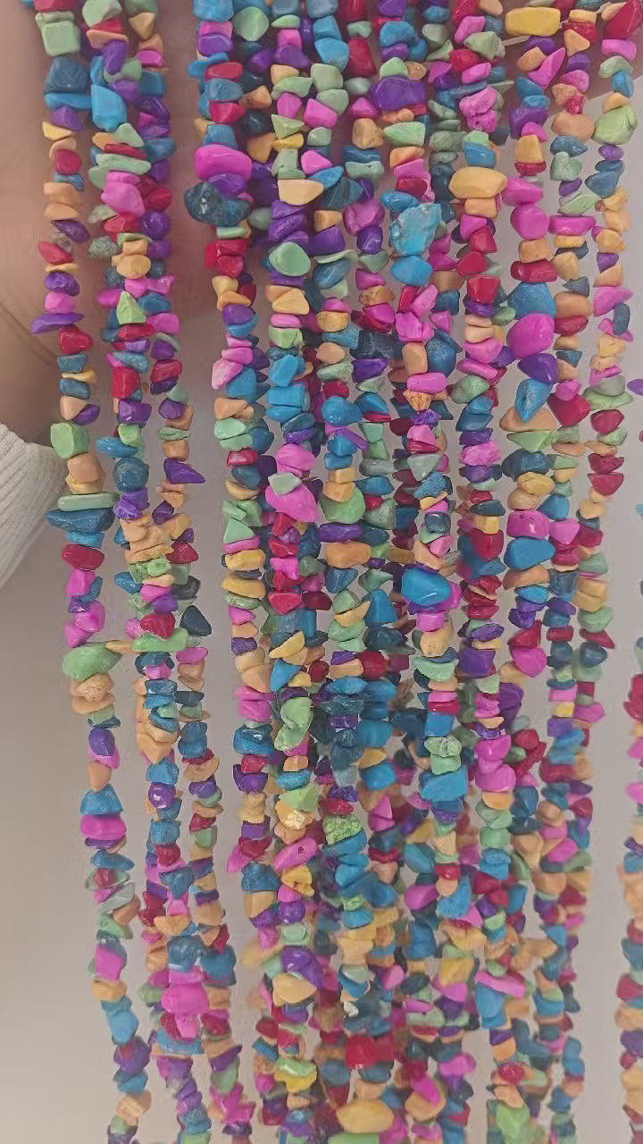 360 rotation of rainbow dyed howlite irregular bead long necklace, full color spectrum with black spiderweb matrix visible from all angles