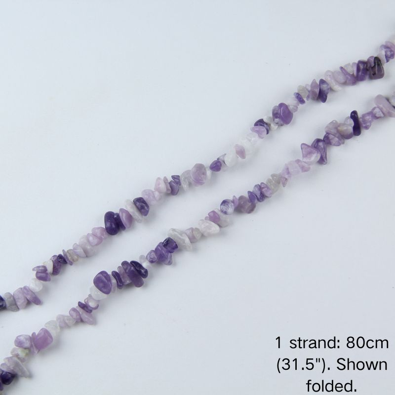 Purple lilac quartz chip beads strand folded on white background, 31.5 inches long, nylon cord.