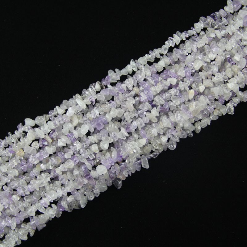 stacked coils of purple white crystal bead strand, 31.5 inches long, irregular round 5-8mm beads on nylon cord