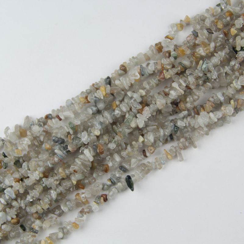 Multiple strands of natural colorful rabbit hair crystal beads stacked together, showing 5-8mm multi-color rutilated quartz chips with hair-like inclusions