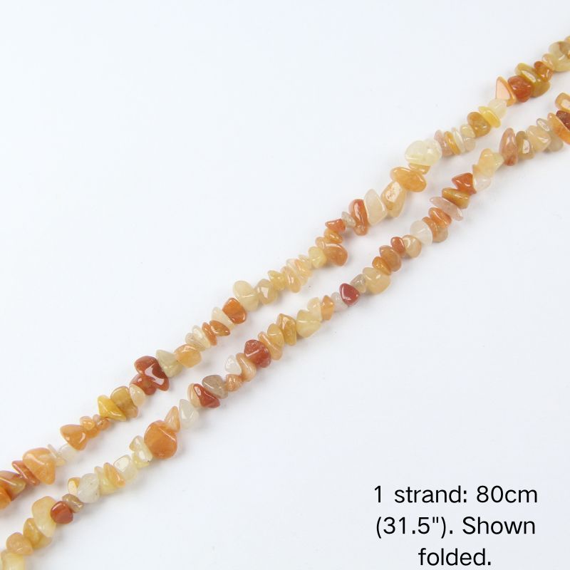 A single strand of Red Aventurine irregular chip beads (80cm/31.5") shown folded to display actual length and nylon cord.