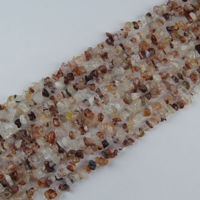 31.5 inch red floral inclusion quartz irregular bead necklace laid flat on white background showing red flower-like inclusions