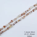A single 80cm (31.5") strand of Red Hematoid Quartz irregular chip beads, folded to display actual length and nylon cord for jewelry making.