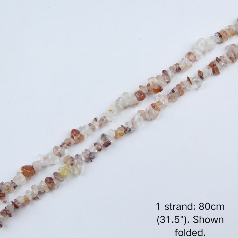 A single 80cm (31.5") strand of Red Hematoid Quartz irregular chip beads, folded to display actual length and nylon cord for jewelry making.