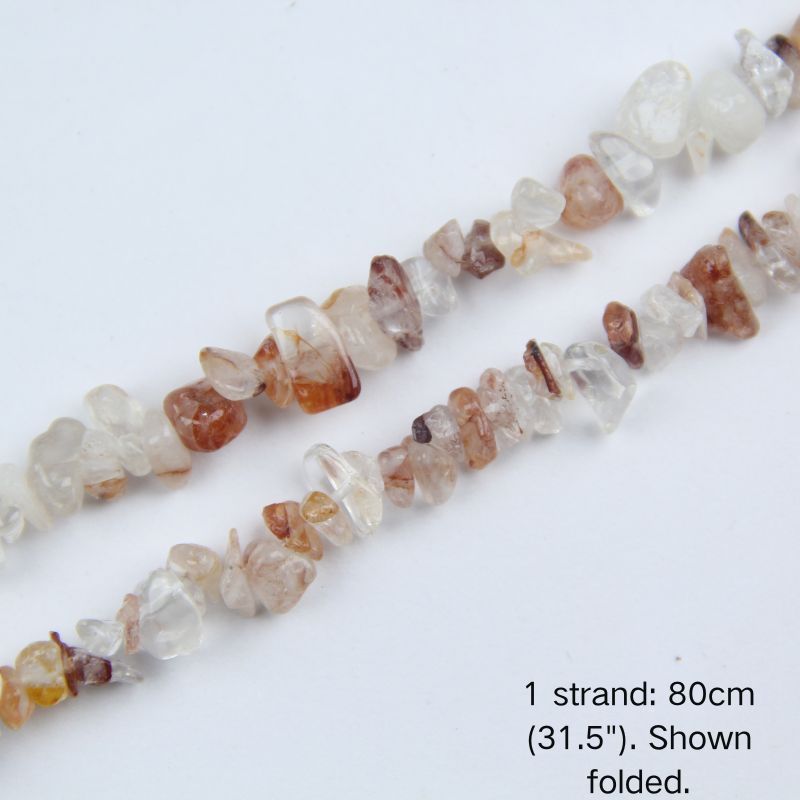 Macro close-up of 5-8mm Red Hematoid Quartz chip beads, showing polished translucent crystal, vibrant rust-red iron oxide inclusions, and center-drilled holes.