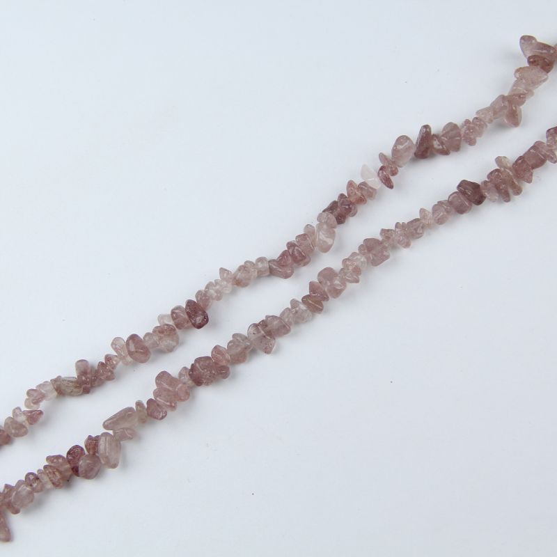 single flat lay of red strawberry quartz necklace strand, 31.5 inches, 5-8mm irregular round beads strung on nylon cord