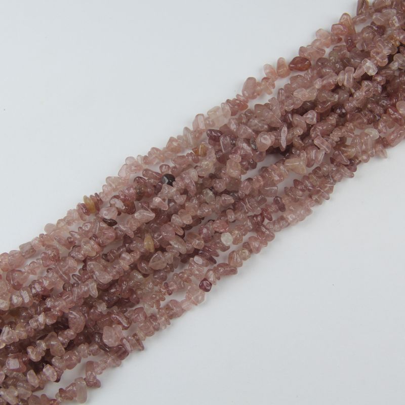 stacked coils of red strawberry quartz bead strand, 31.5 inches long, irregular round 5-8mm beads on nylon cord
