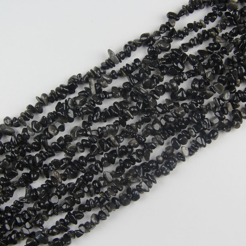 31.5 inch silver obsidian irregular bead necklace laid flat on white background showing subtle metallic silver sheen on black stone