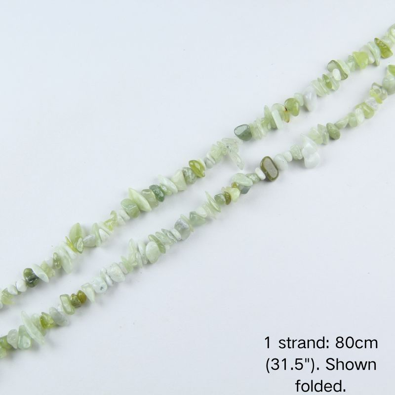 Single folded strand of 80cm natural mint green jade irregular crushed nugget beads.