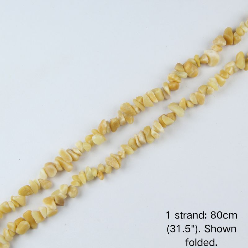 Single folded strand of 80cm natural yellow jade irregular crushed nugget beads.