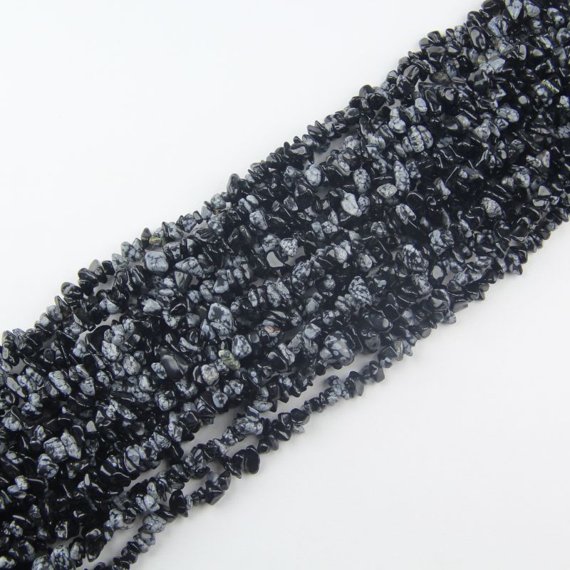 multiple snowflake obsidian long necklaces hanging together stacked showing natural drape and layered effect
