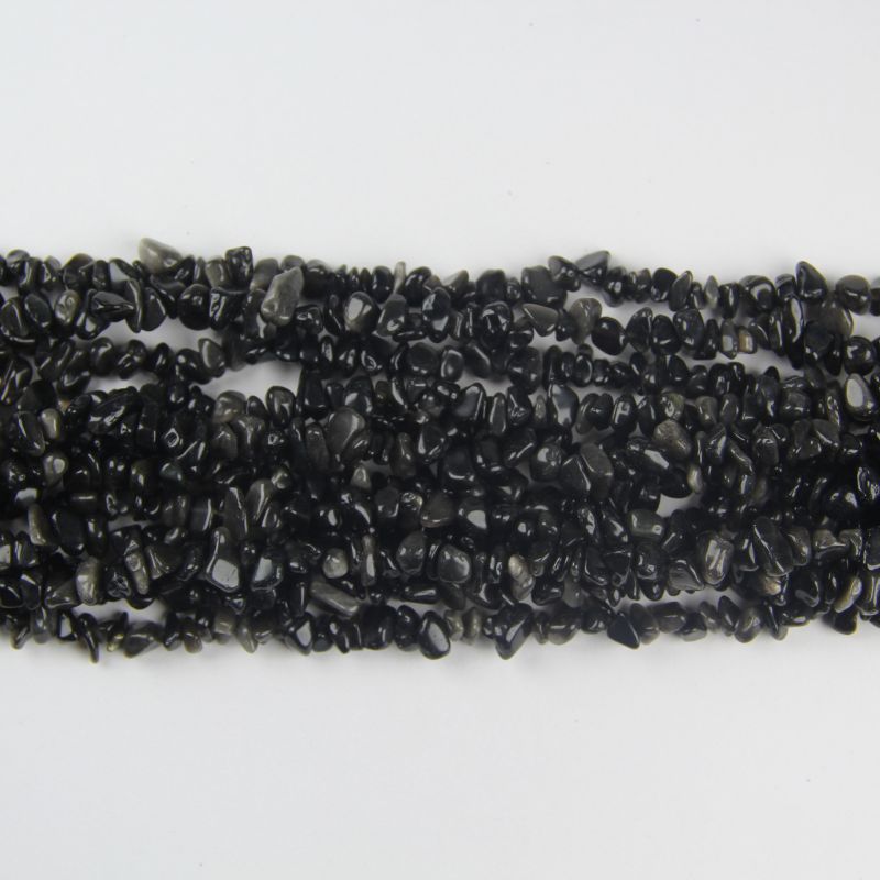 multiple silver obsidian long bead necklaces stacked flat lay on white background showing metallic silver sheen on each chain
