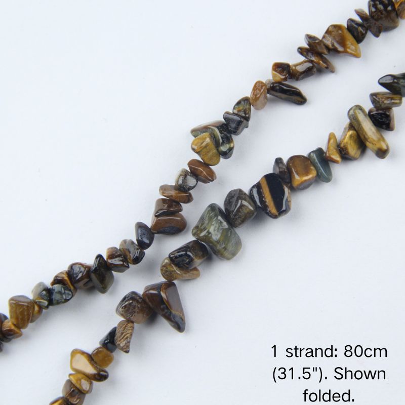 Close-up view of tiger's eye chip cord, 80cm folded, showing 5-8mm natural raw stones with smooth polished finish and cat's eye glow.