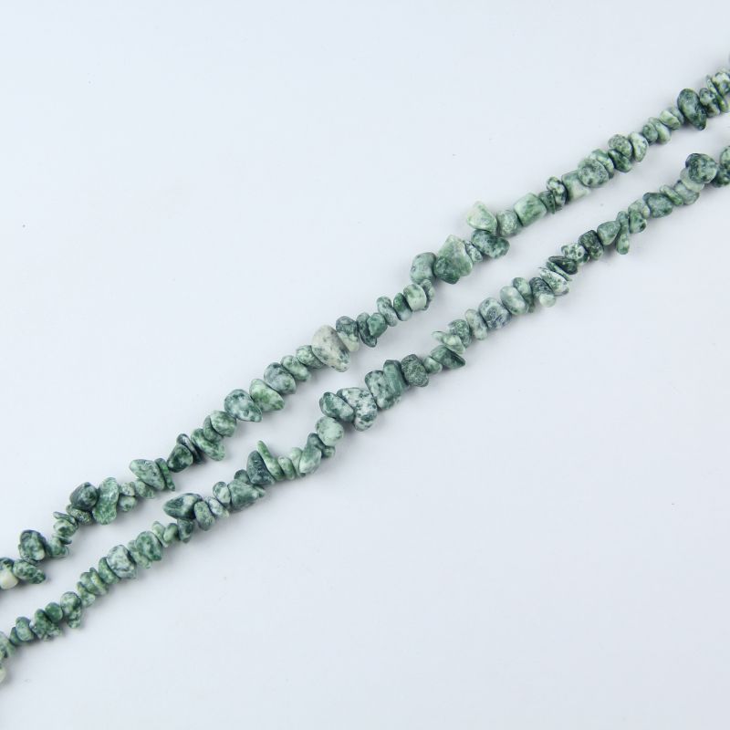 Single natural tree agate irregular bead necklace laid flat on light surface, 31-inch length with organic round beads