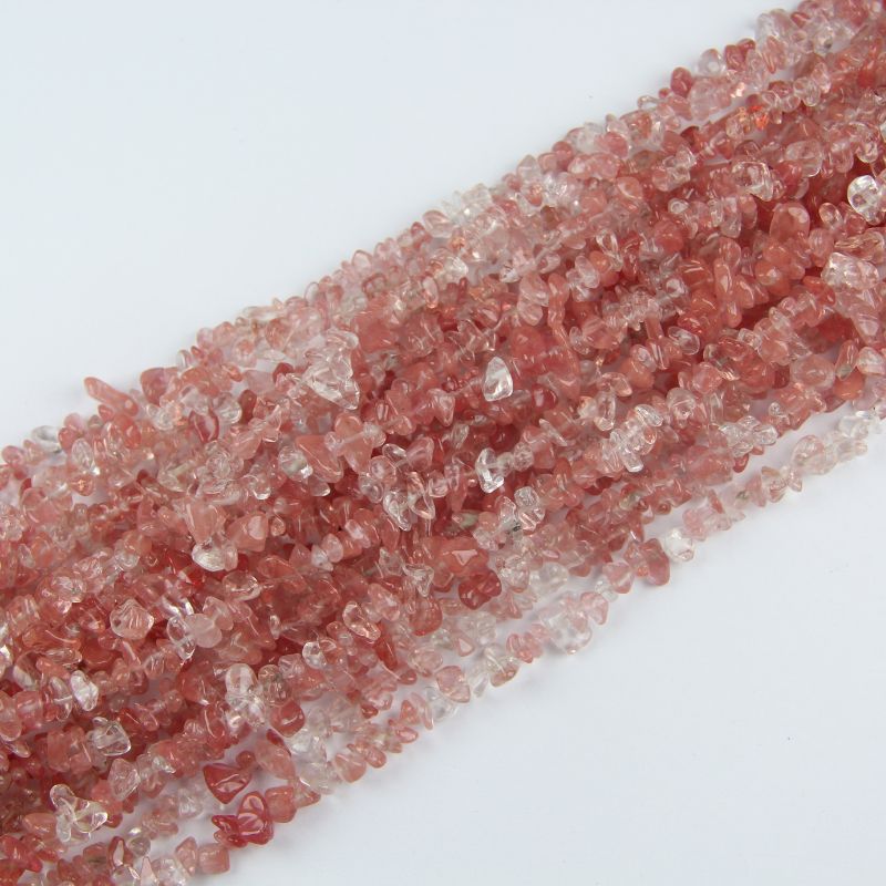 stacked coils of watermelon red crystal bead strand, 31.5 inches long, irregular round 5-8mm beads on nylon cord