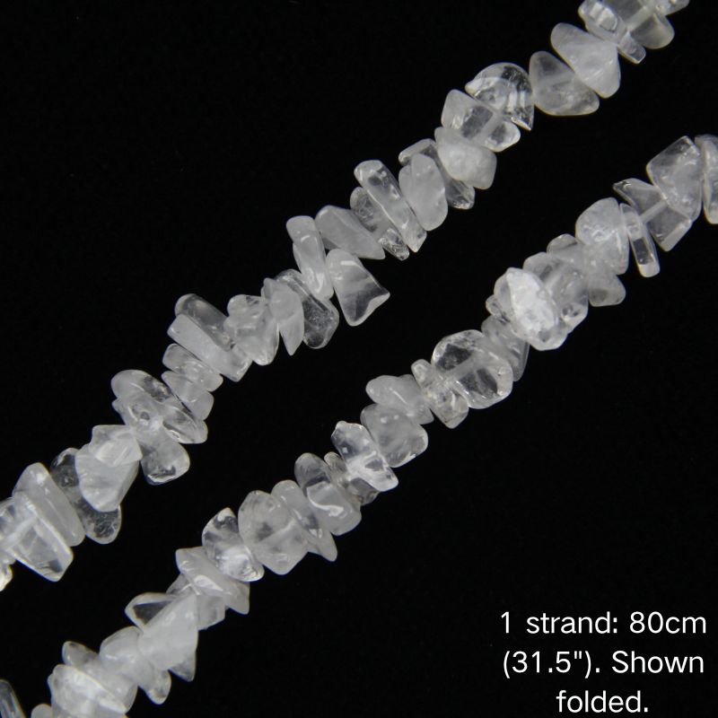 Macro close-up of white cotton quartz chip beads, 5-8mm polished irregular chips with natural inclusions.
