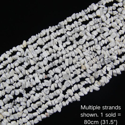 Multiple strands of white howlite chip beads, 5-8mm polished chips, natural grey veining.