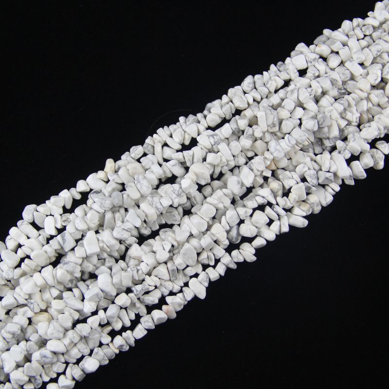 stacked coils of white howlite bead strand, 31.5 inches long, irregular round 5-8mm beads with marble veining on nylon cord