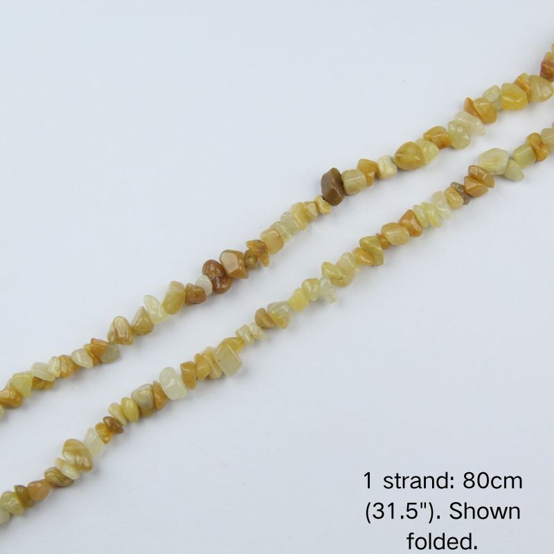 A single strand of Yellow Aventurine irregular chip beads (80cm/31.5") shown folded to display actual length and nylon cord.