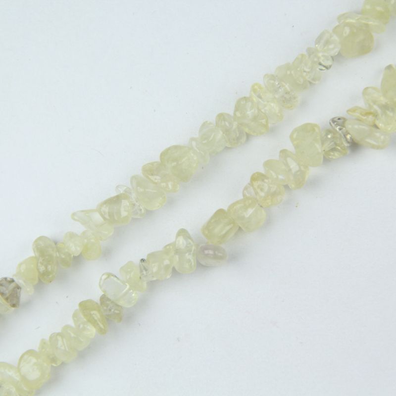 close-up of yellow citrine irregular round beads showing natural golden color and nylon cord stringing, 5-8mm size
