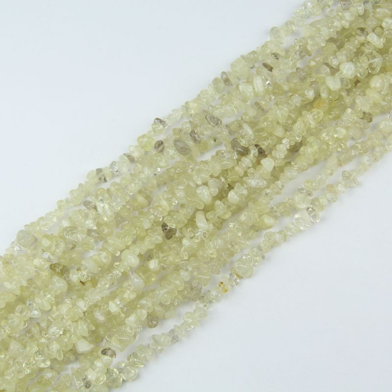 stacked coils of yellow citrine bead strand, 31.5 inches long, irregular round 5-8mm beads on nylon cord