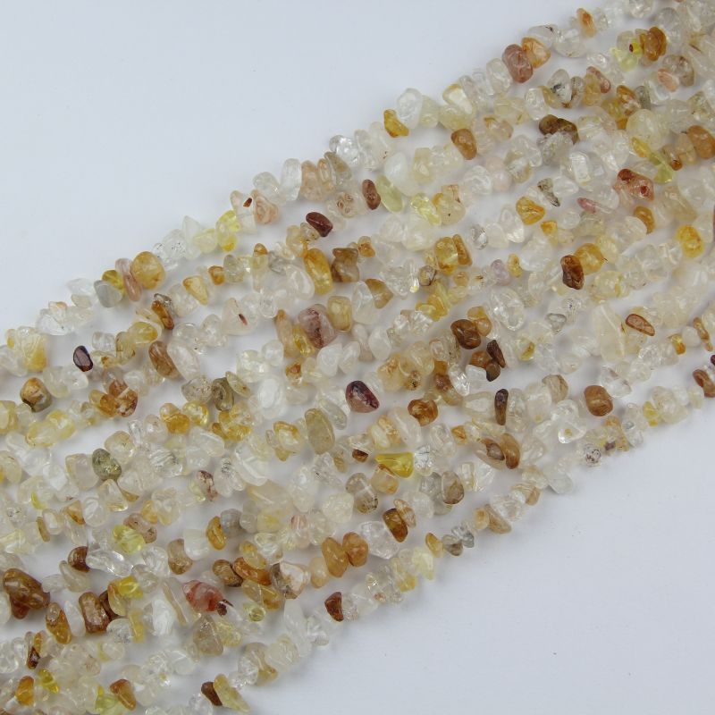 31.5 inch yellow floral inclusion quartz irregular bead necklace laid flat on white background showing golden-yellow flower-like inclusions