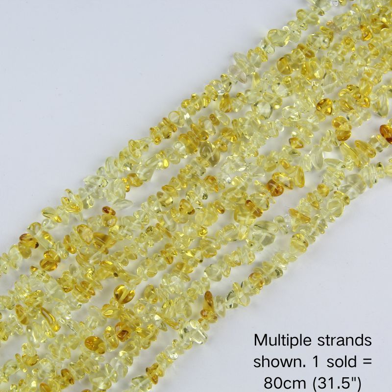 Multiple strands of 31.5" yellow irregular glass chip beads (5-8mm) displayed on a white background. Note: 1 strand sold per order, measuring 80cm (31.5").