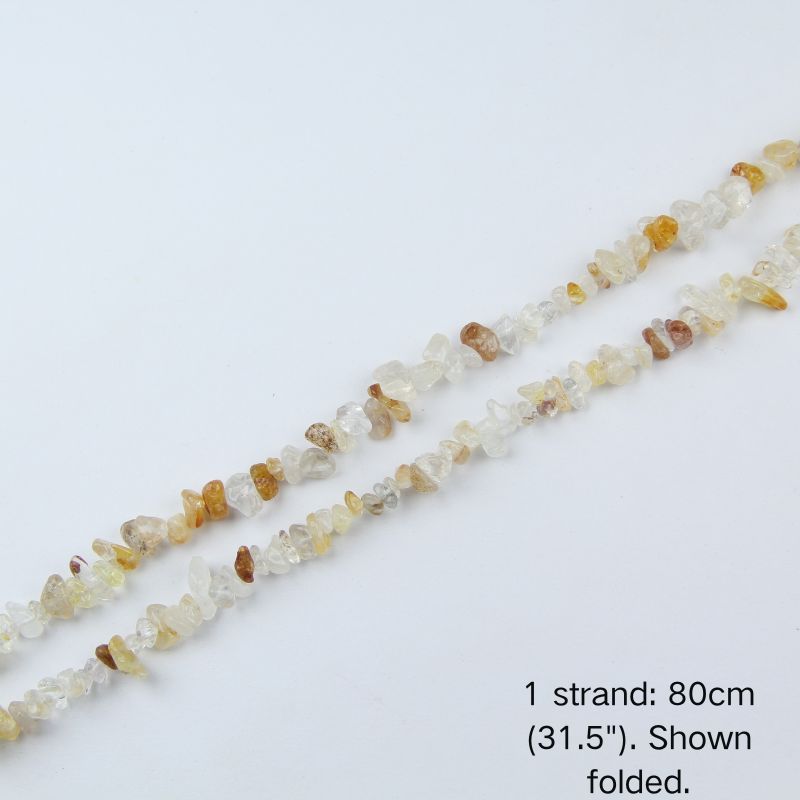 Yellow hematoid quartz chip beads folded on white background, 80cm strand, lightweight 70g.